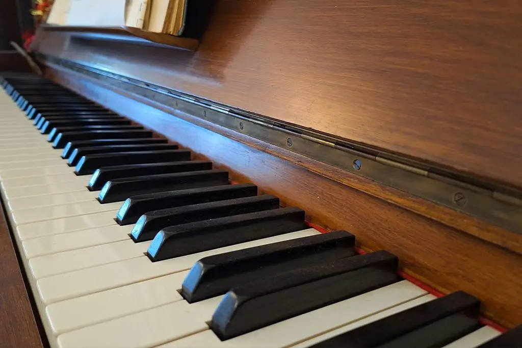 Close-up of piano keys on a wooden piano