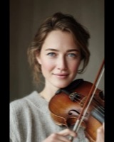 Smiling woman holding a viola and bow